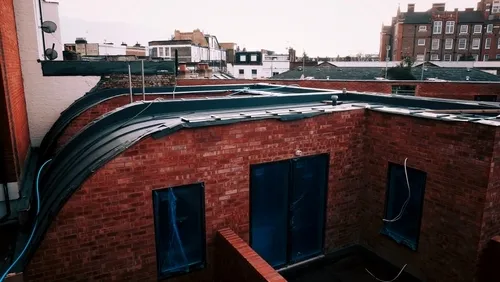 men working between houses